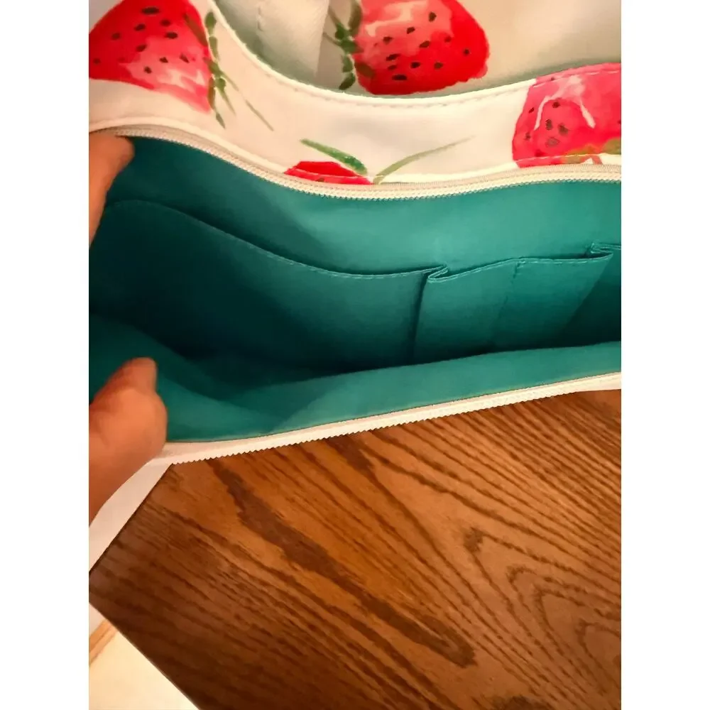 Canvaslove laptop sleeve features strawberry print, detachable shoulder strap